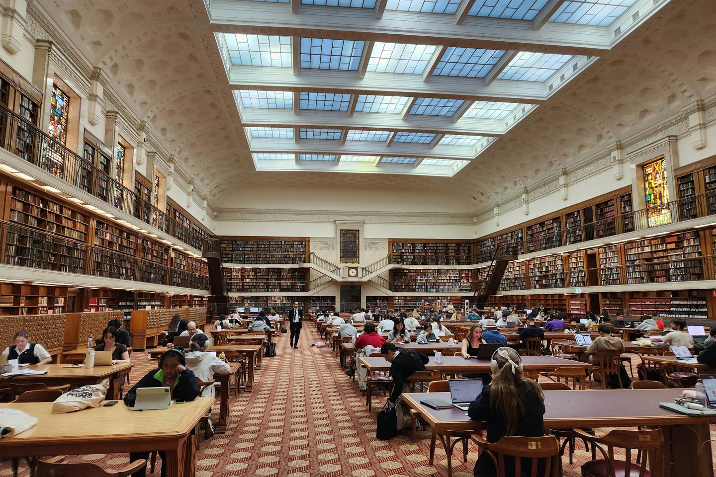 Readers at study desks in the State Library of New South Wales