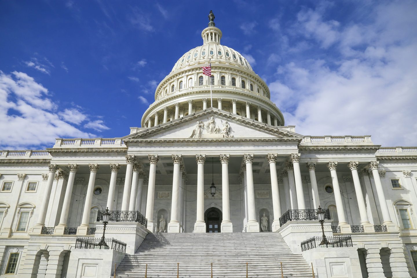 The United States Capitol building beneath a blue sky