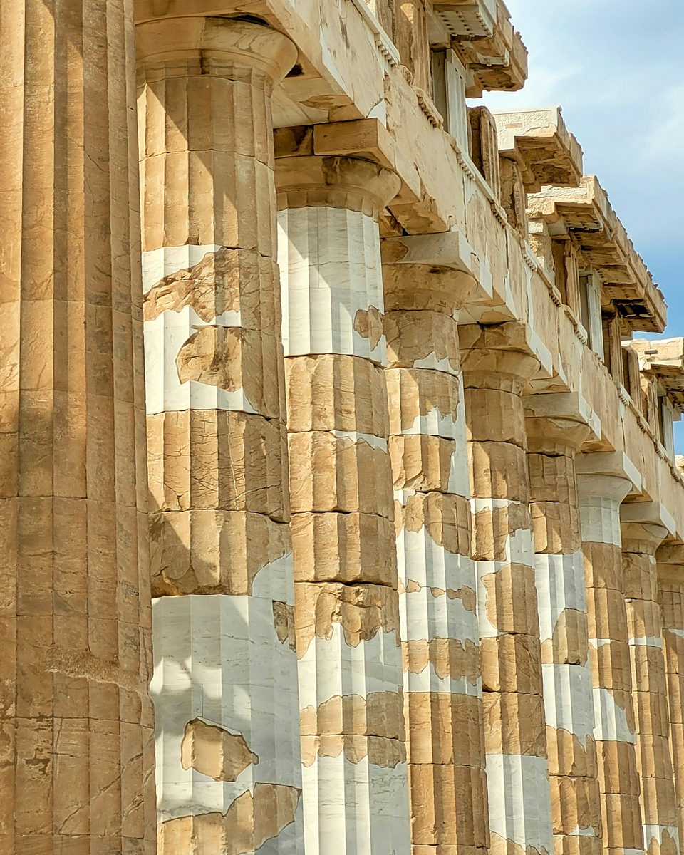 Sunlit stone columns of the Parthenon in Athens